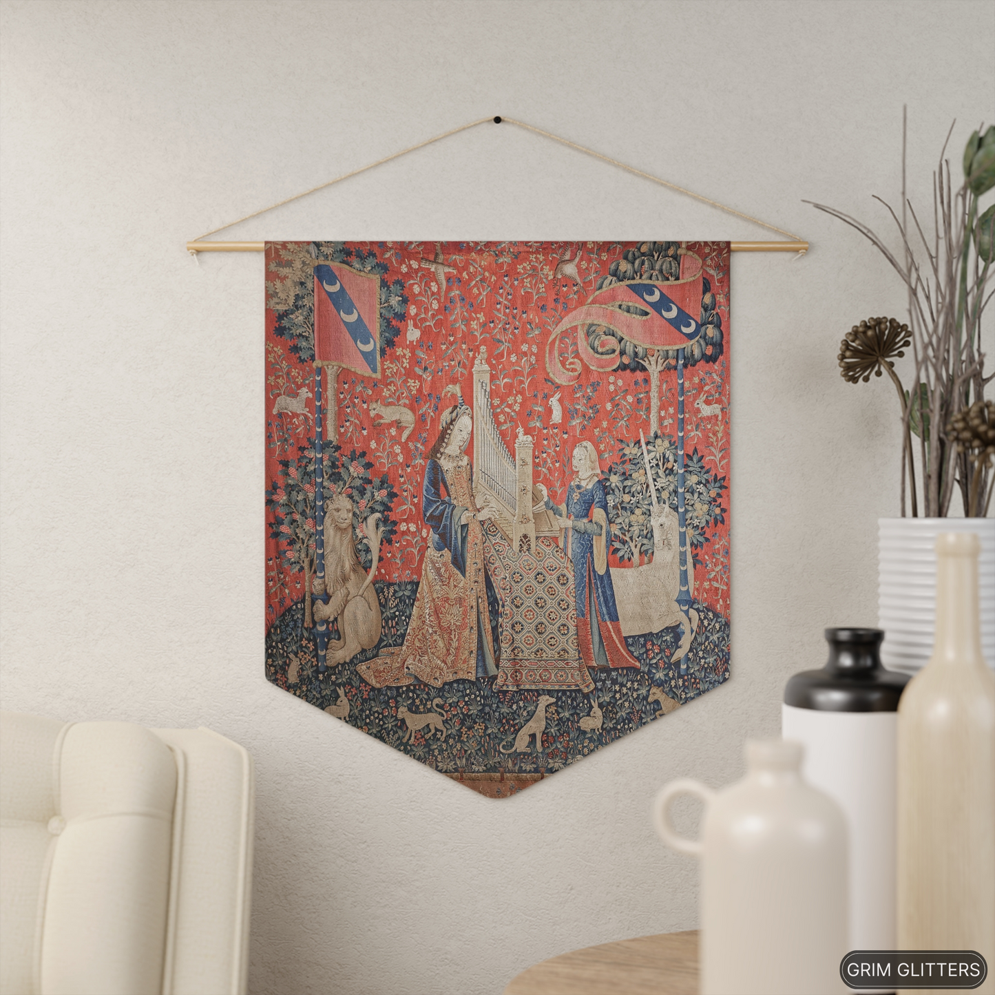 Step into the world of medieval art with The Lady and the Unicorn (Hearing) Pennant Banner from Grim Glitters. Inspired by the iconic Unicorn Tapestries.