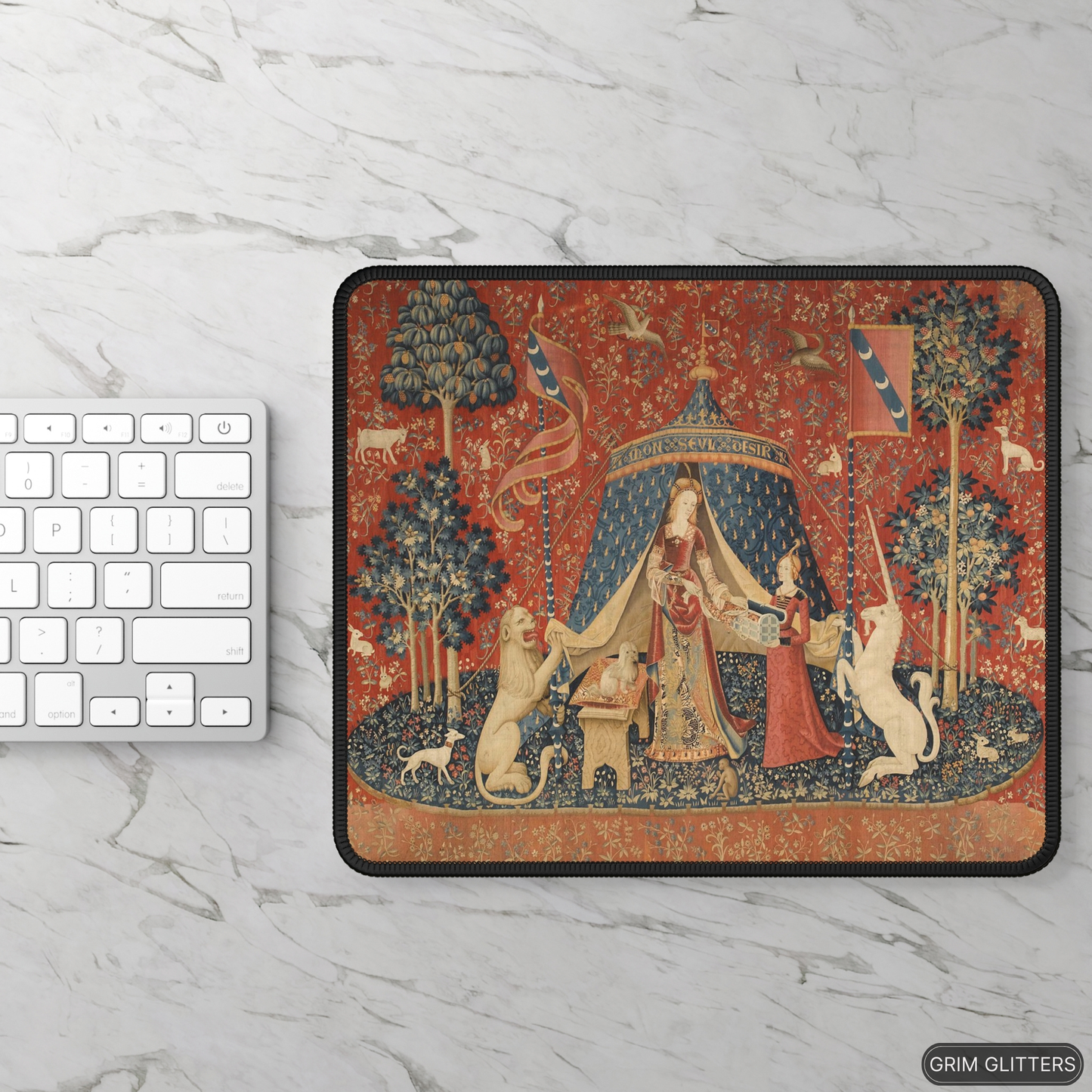 Enhance your gaming experience with the enchanting Lady and the Unicorn (Desire) Gaming Mouse Pad from Grim Glitters. Featuring the iconic medieval tapestry, this mouse pad combines historical charm with modern functionality, adding a touch of elegance to