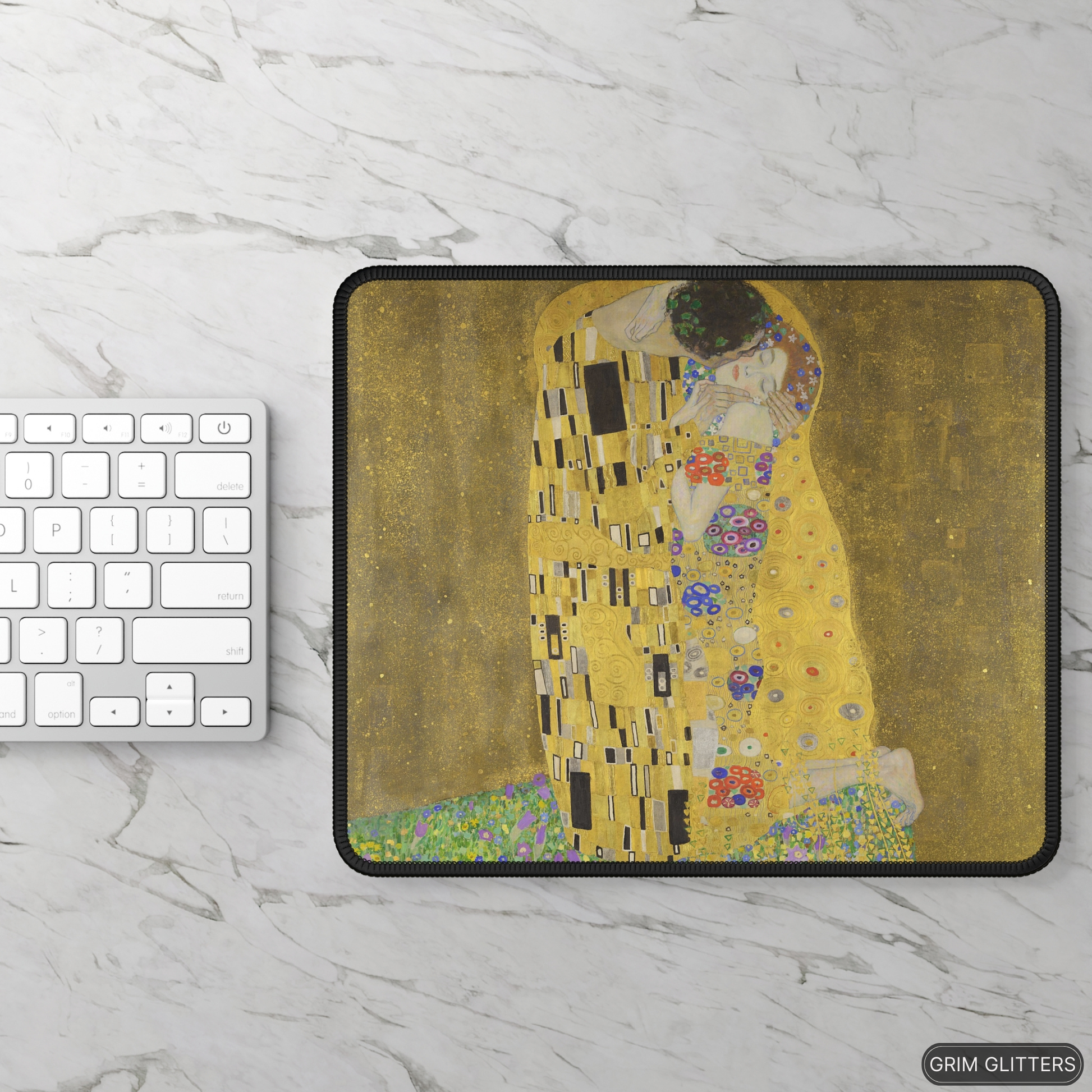 Enhance your gaming experience with The Kiss Gaming Mouse Pad from Grim Glitters. Inspired by Gustav Klimt's iconic masterpiece, this mouse pad combines artistic elegance with modern functionality, making it a stunning addition to any gaming setup or work