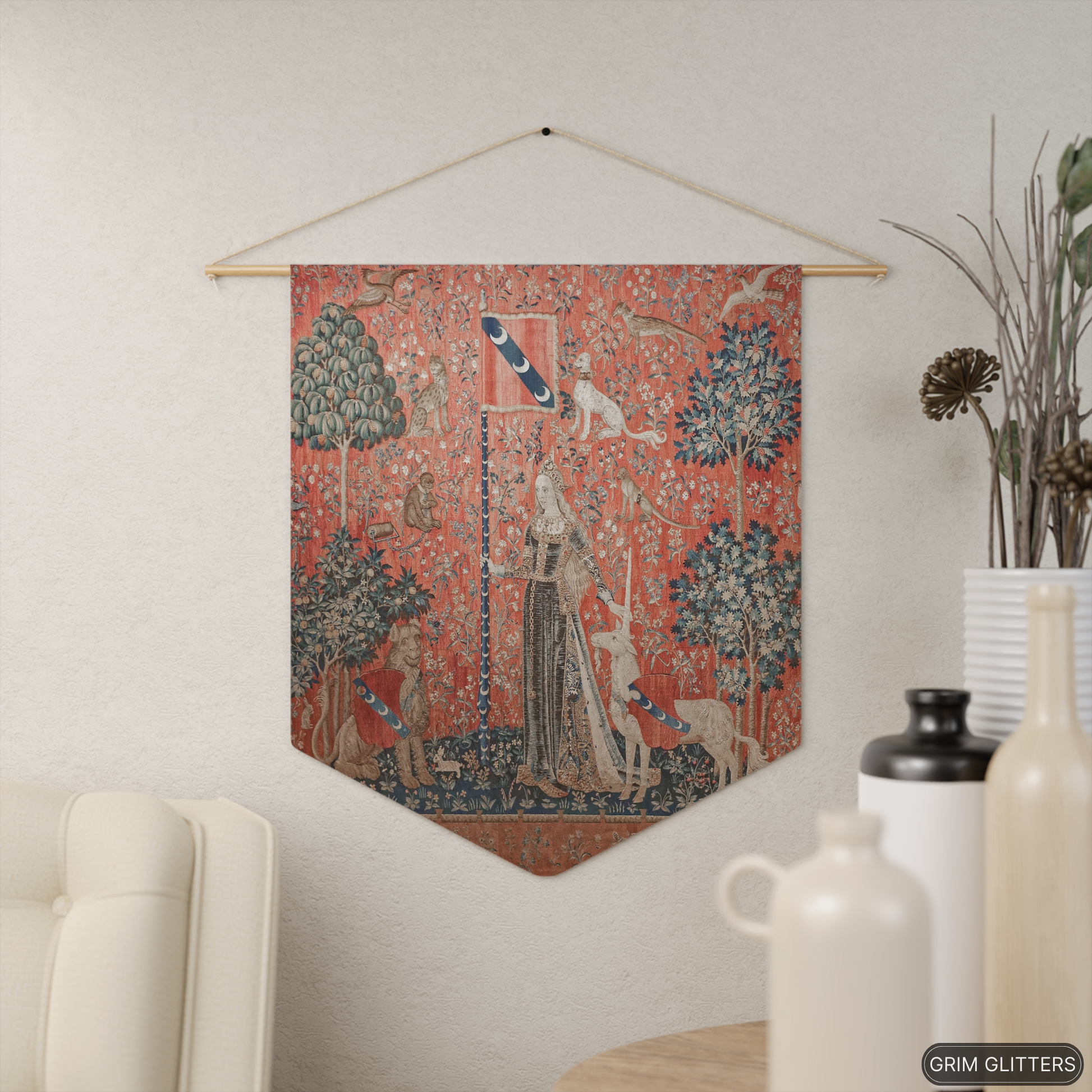 Step into the enchanting world of medieval art with The Lady and the Unicorn (Touch) Pennant Banner from Grim Glitters. This exquisite banner captures the essence of mystery and magic, perfect for adding a touch of historical charm to any space.