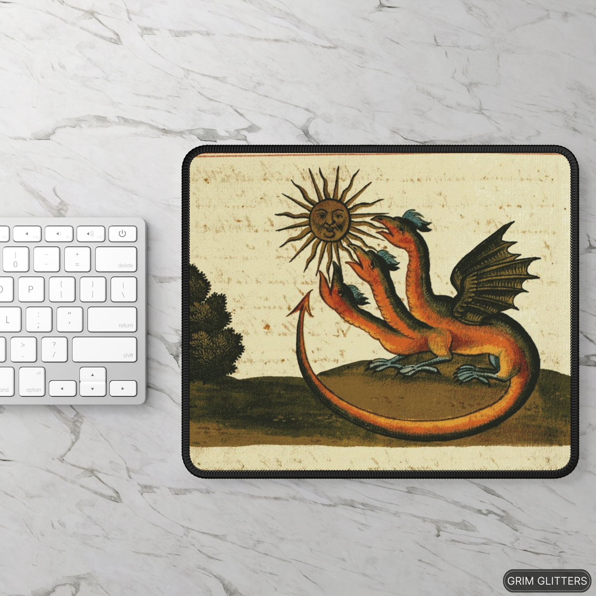 Enhance your gaming setup with the mystical Three-Headed Dragon Gaming Mouse Pad from Grim Glitters. Inspired by the Clavis Artis manuscript, this mouse pad features a captivating three-headed dragon design, blending alchemical symbolism with modern funct