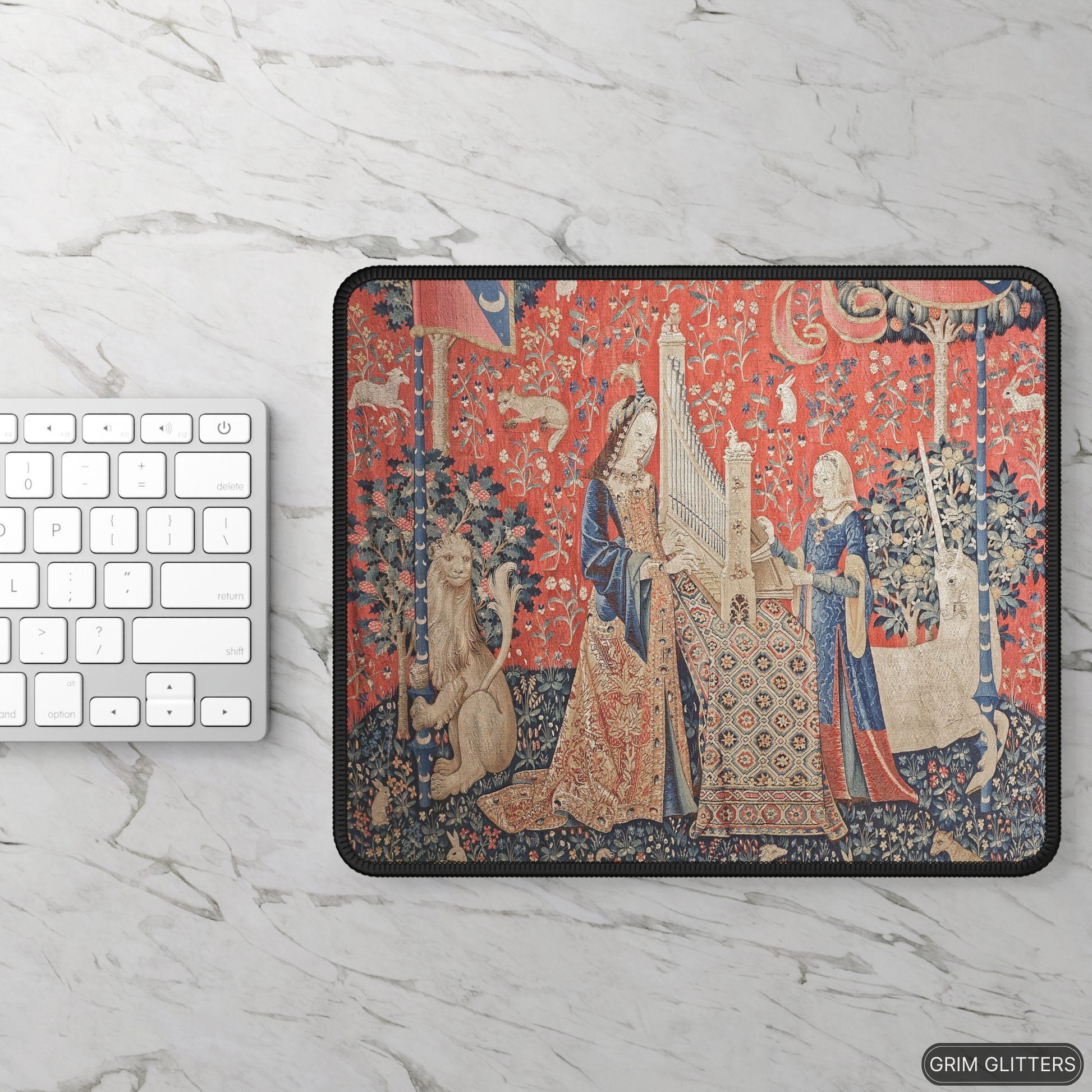 Enhance your gaming experience with the enchanting Lady and the Unicorn (Hearing) Gaming Mouse Pad from Grim Glitters. Inspired by the iconic medieval tapestry, this mouse pad combines historical charm with modern functionality, adding a touch of elegance