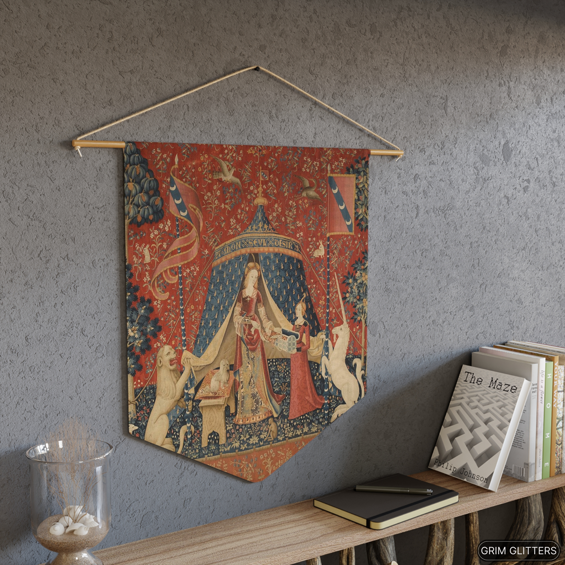 Add a touch of medieval magic to your decor with The Lady and the Unicorn (Desire) Pennant Banner from Grim Glitters. This beautiful banner, inspired by the iconic Unicorn Tapestries, brings historical charm and fantasy allure to any space.