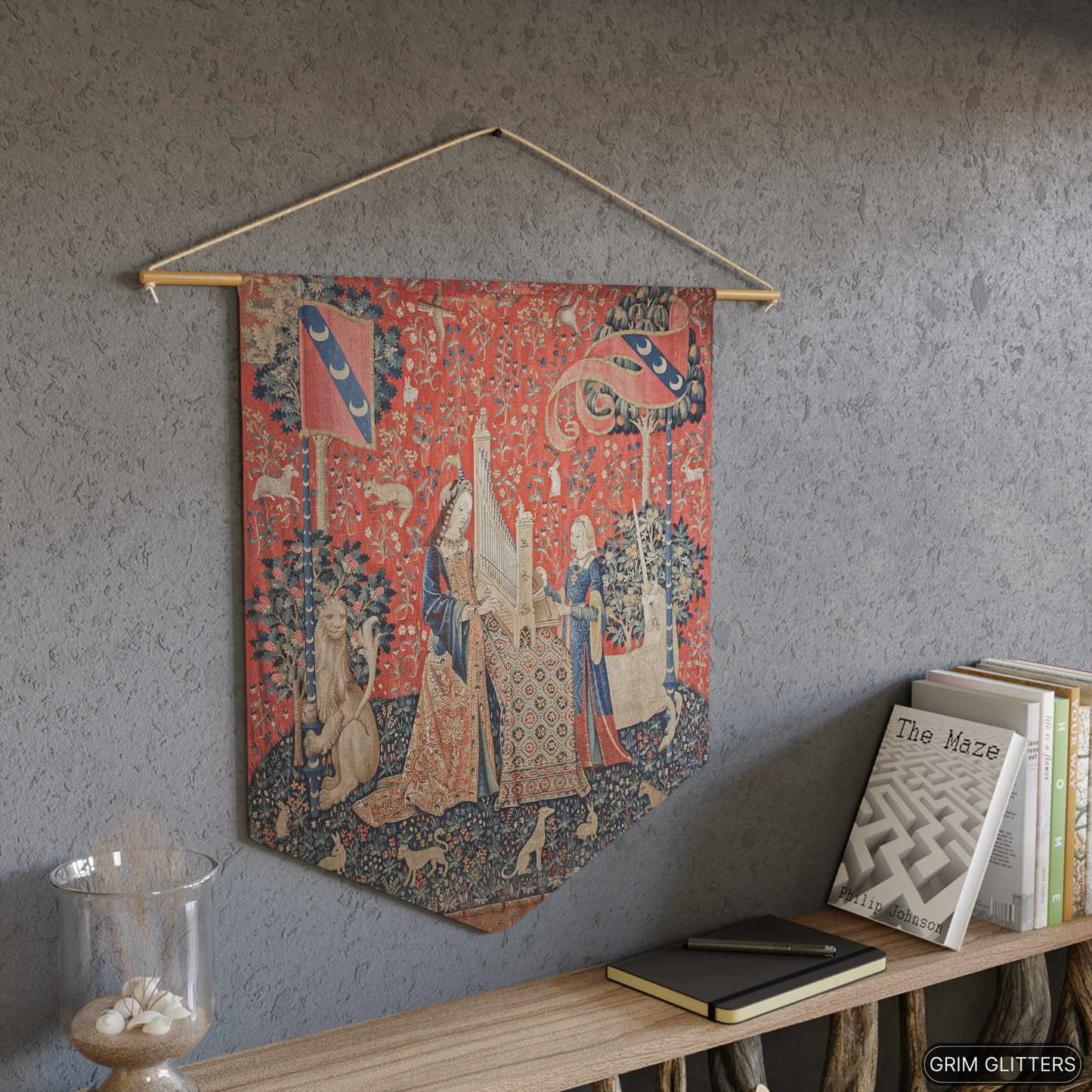 Step into the world of medieval art with The Lady and the Unicorn (Hearing) Pennant Banner from Grim Glitters. Inspired by the iconic Unicorn Tapestries.