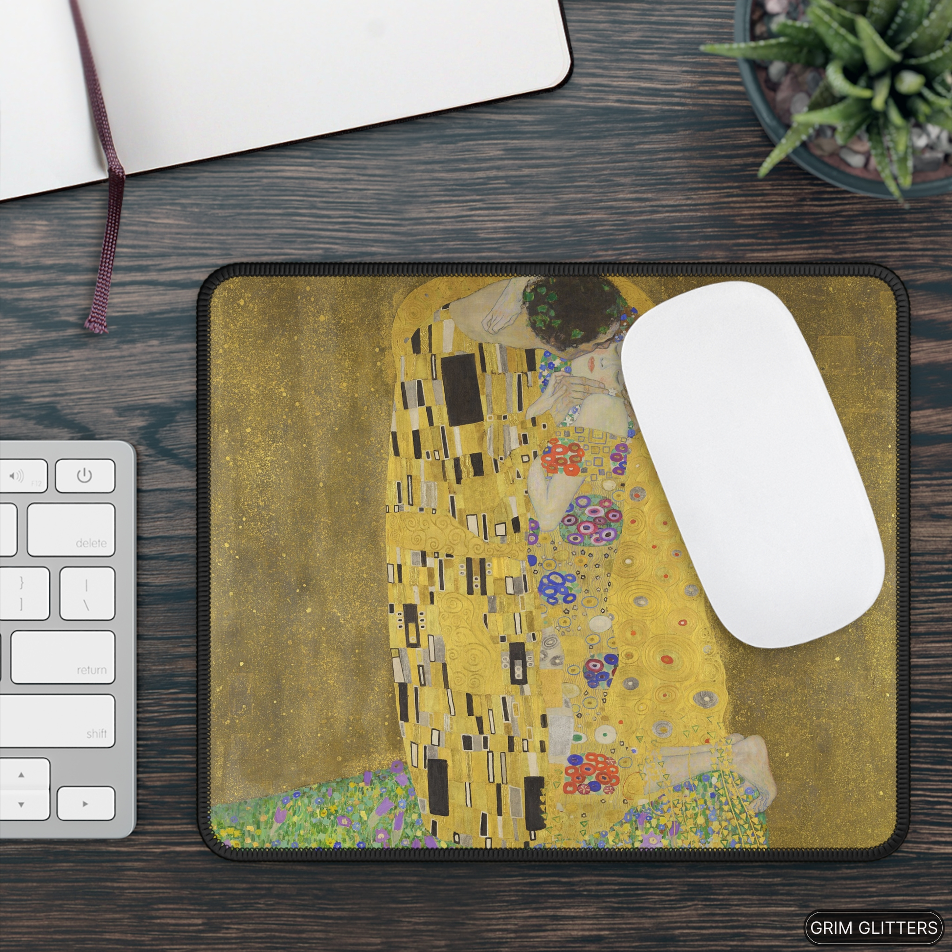 Enhance your gaming experience with The Kiss Gaming Mouse Pad from Grim Glitters. Inspired by Gustav Klimt's iconic masterpiece, this mouse pad combines artistic elegance with modern functionality, making it a stunning addition to any gaming setup or work