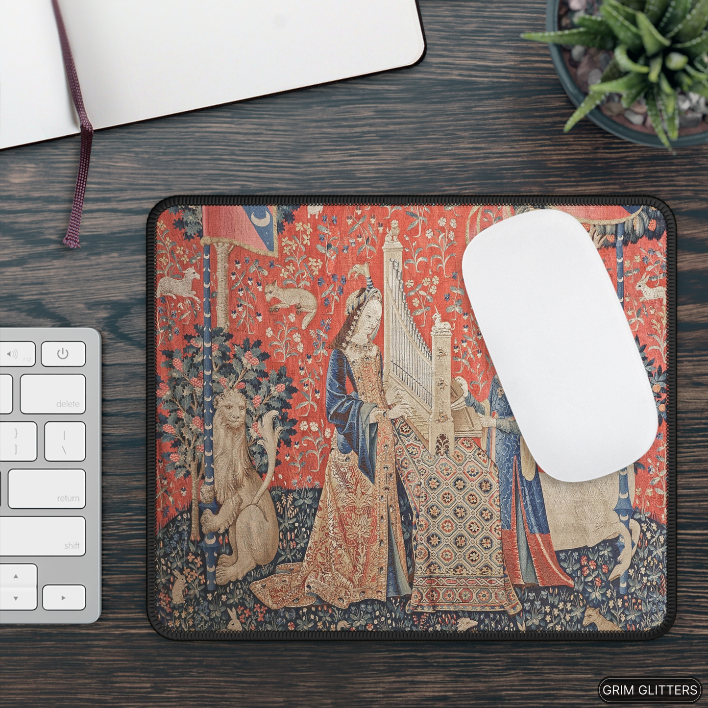 Enhance your gaming experience with the enchanting Lady and the Unicorn (Hearing) Gaming Mouse Pad from Grim Glitters. Inspired by the iconic medieval tapestry, this mouse pad combines historical charm with modern functionality, adding a touch of elegance