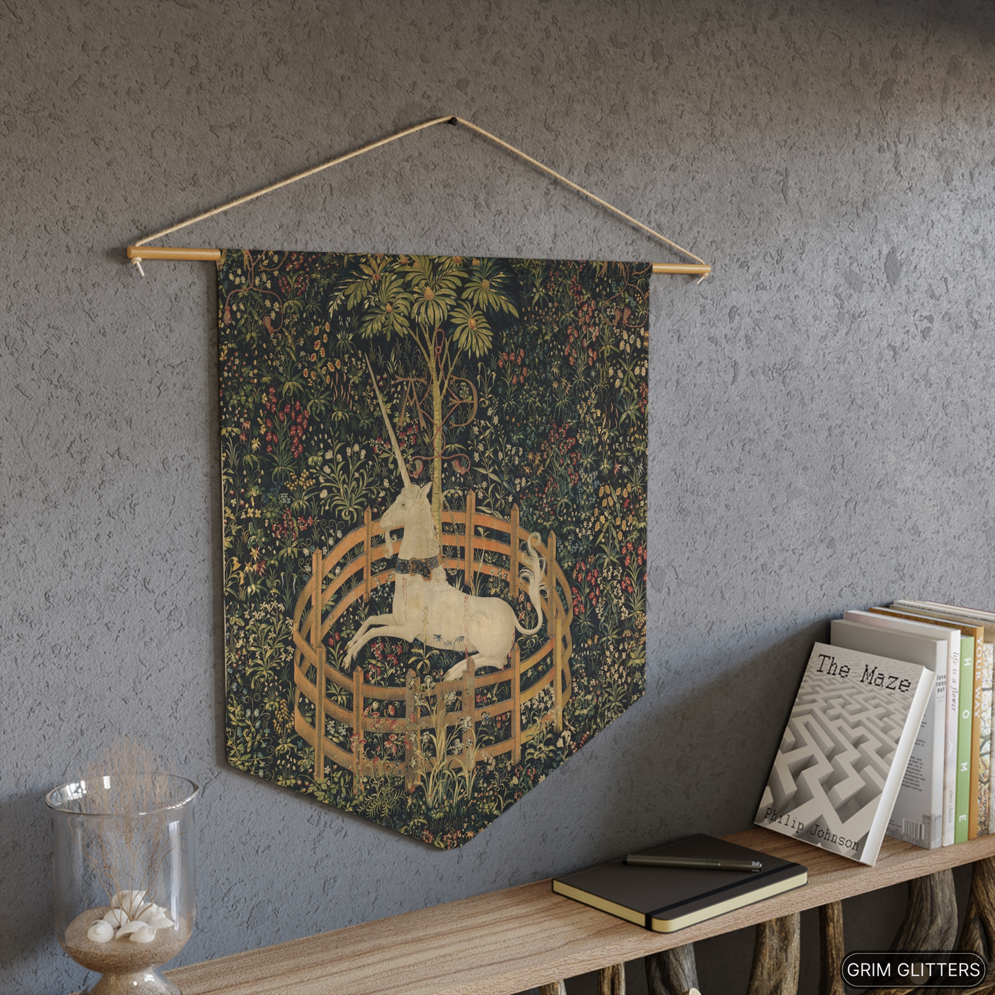 Add a touch of medieval charm to your home with the Unicorn in Captivity Pennant Banner from Grim Glitters. This banner brings magical allure to any space.