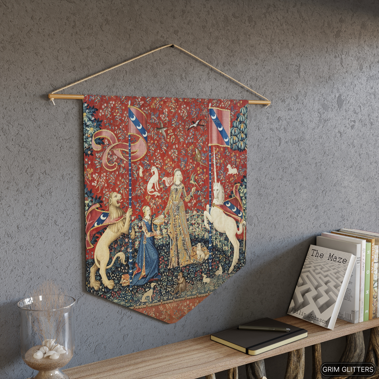 Step into the enchanting world of medieval art with The Lady and the Unicorn (Taste) Pennant Banner from Grim Glitters. This exquisite banner captures the essence of mystery and magic, perfect for adding a touch of historical charm to any space.